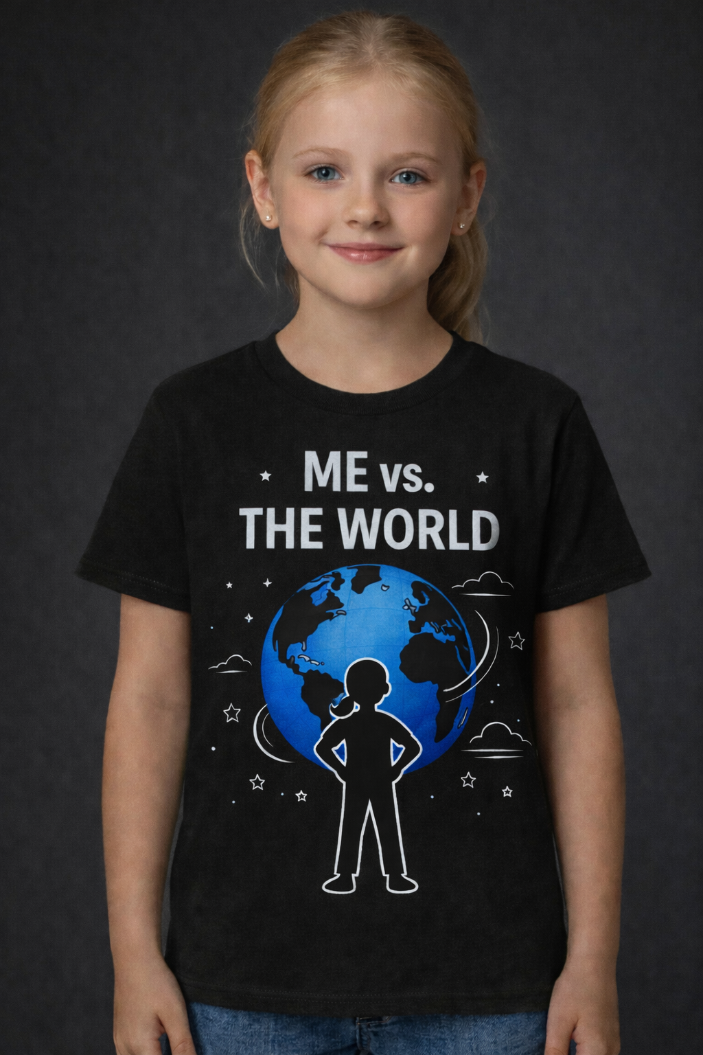 Child wearing a black t-shirt with 'Me vs. The World' design on a black shirt